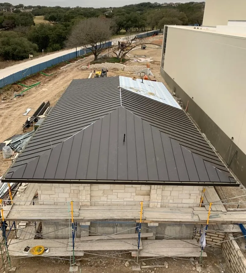 Metal roof new construction with scaffolding in Smithfield